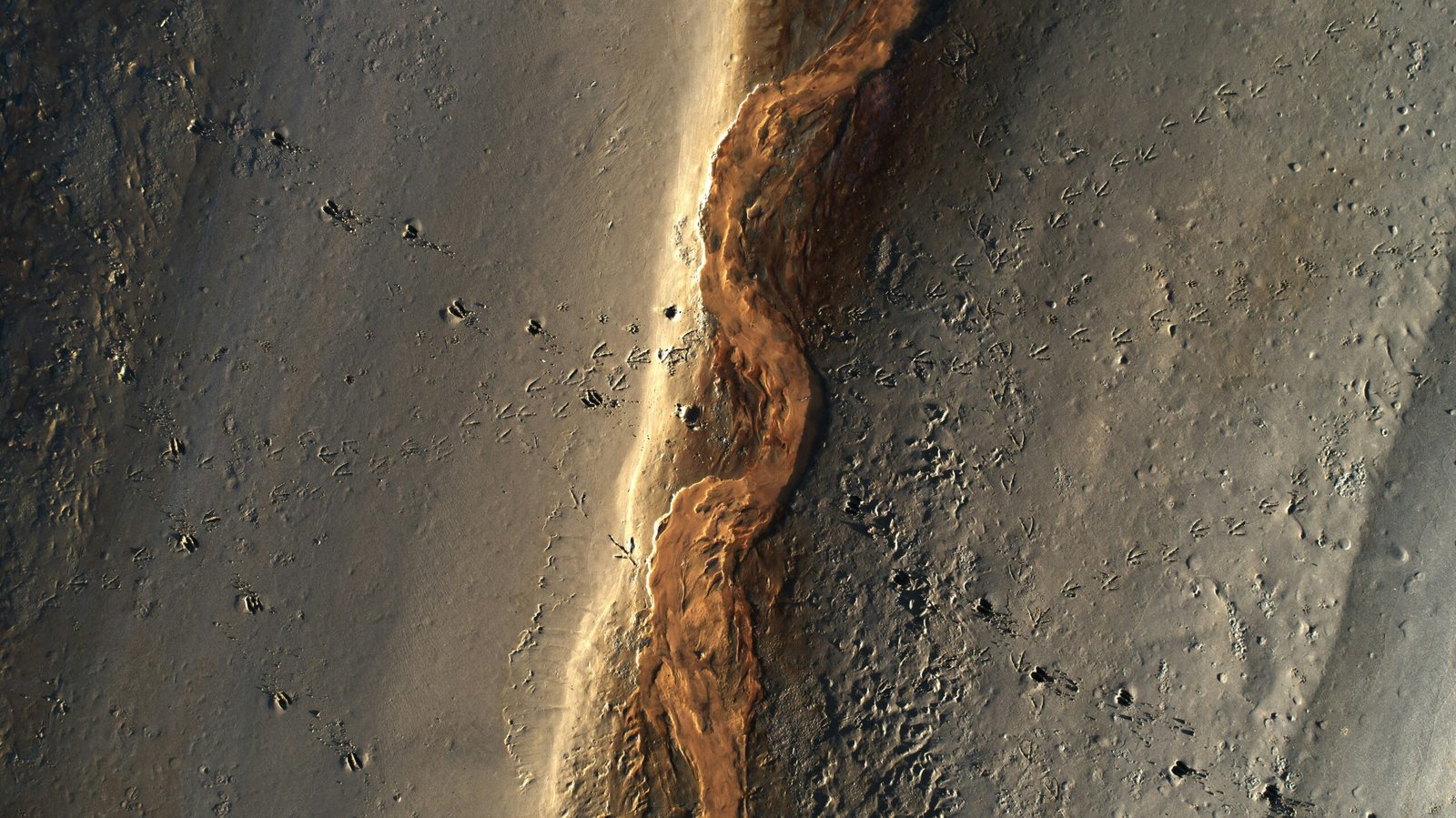 a stream of water running down the side of a mountain